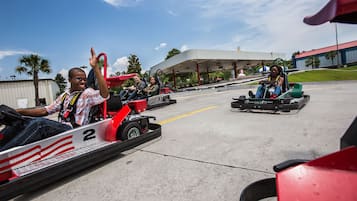 A go-kart track with go-karts and riders.