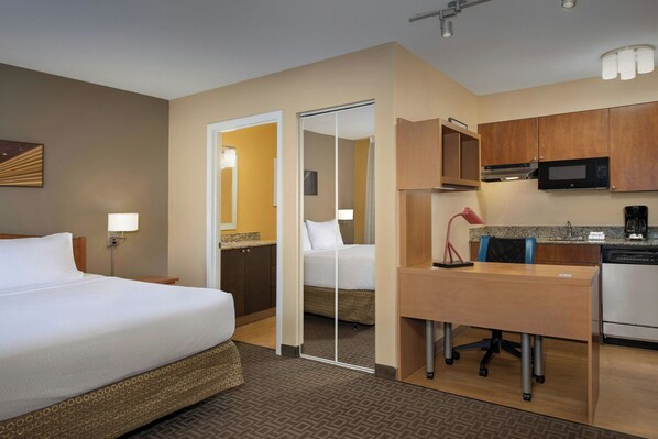 A hotel room with a bed, a desk, a kitchenette, and a bathroom. - TownePlace Suites by Marriott Portland Hillsboro (Hillsboro)