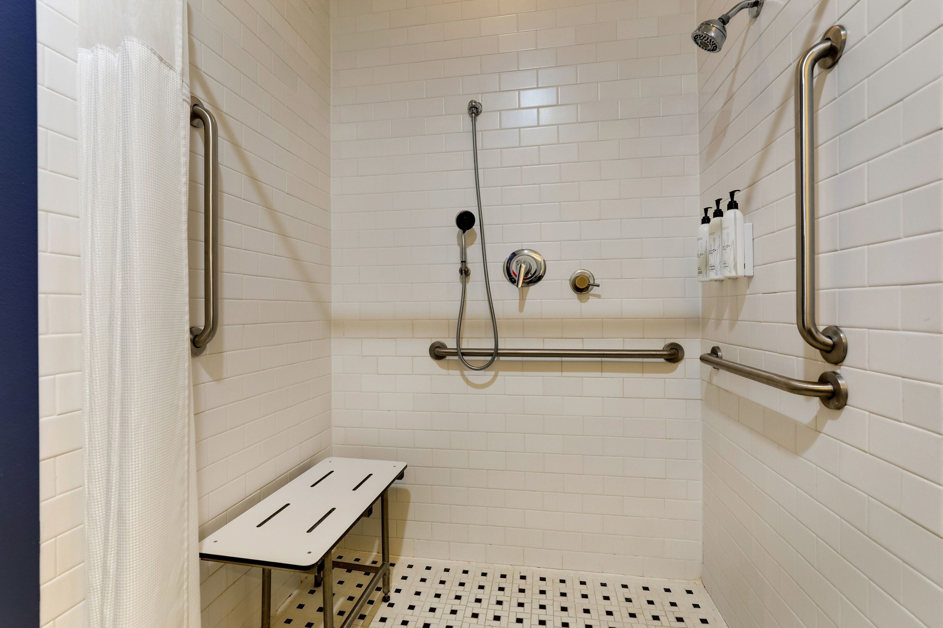 designer toiletries, hair dryer, towels, soap