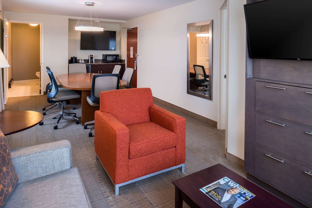 suite, 1 queen bed (boardroom suite - hearing accessible) | in-room safe, desk, laptop workspace, blackout curtains