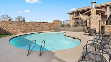 Outdoor pool, open 8 AM to 10 PM, pool umbrellas, pool loungers