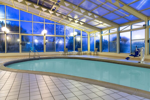 Indoor pool, open 8:00 AM to 10:00 PM, pool loungers