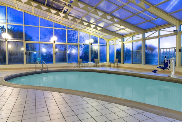 Indoor pool, open 8:00 AM to 10:00 PM, pool loungers