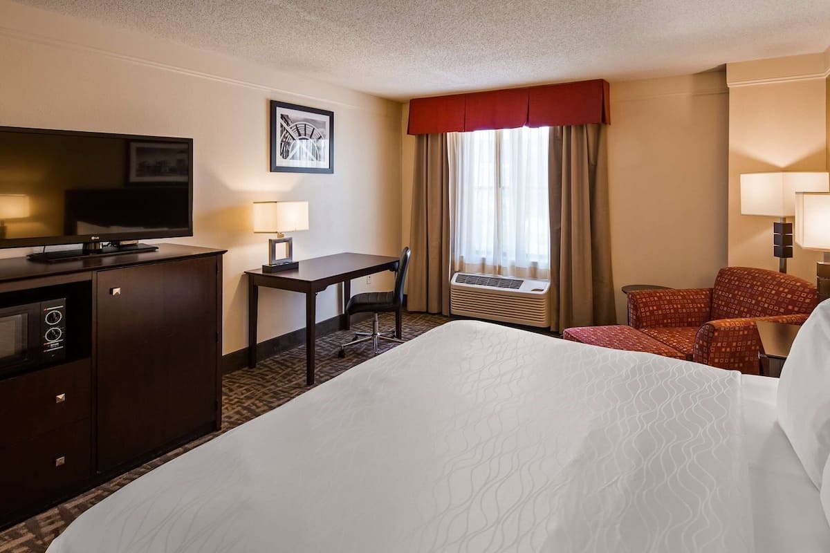 Premium bedding, desk, laptop workspace, iron/ironing board