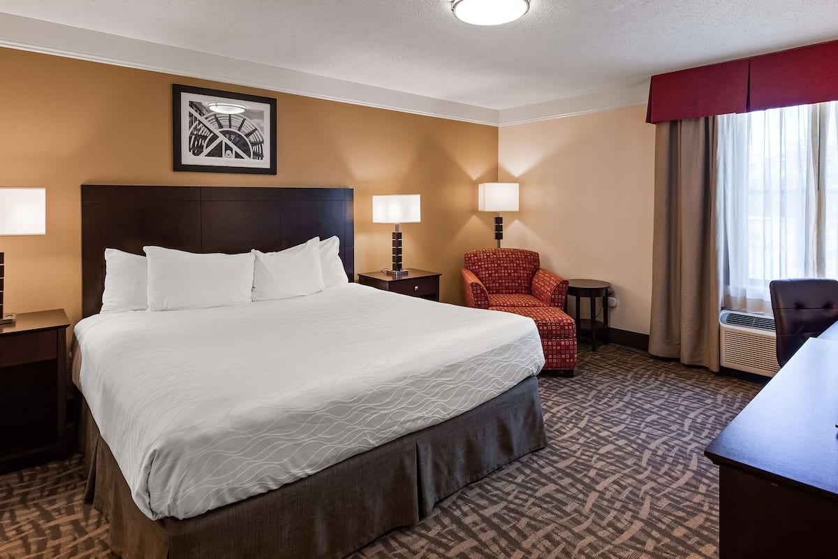 Premium bedding, desk, laptop workspace, iron/ironing board