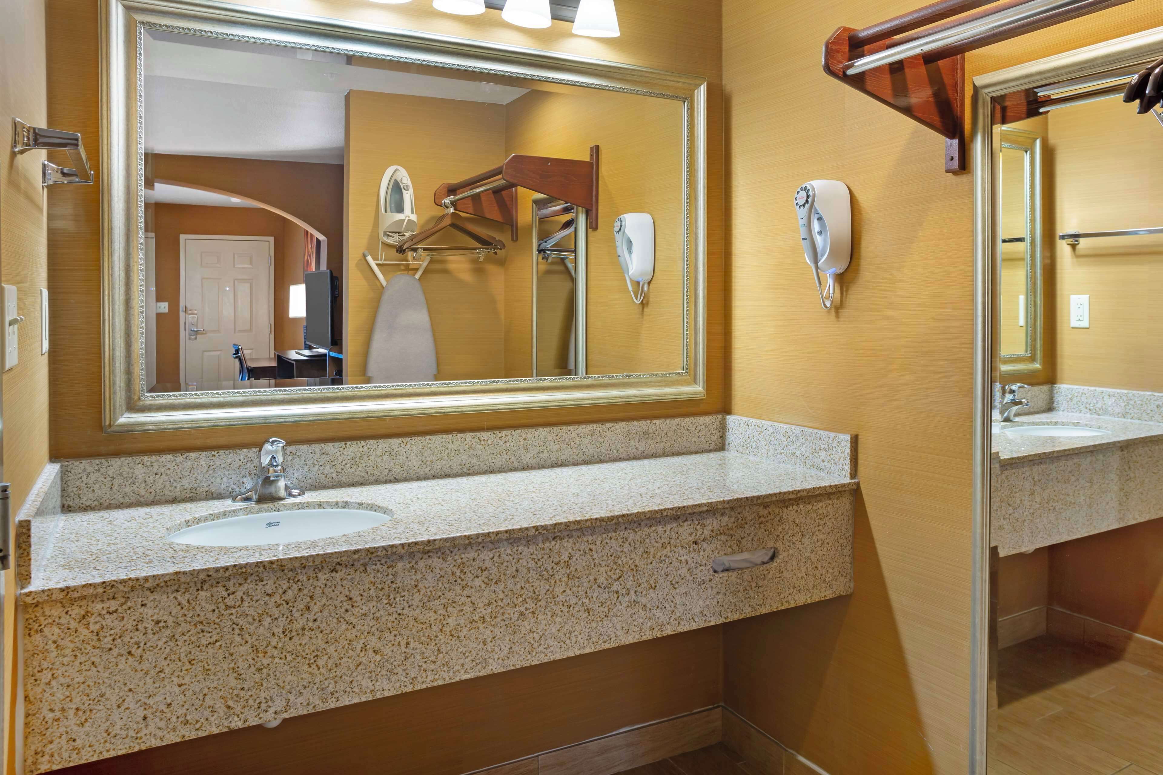 suite, 1 king bed, non smoking, refrigerator & microwave | bathroom | shower, free toiletries, hair dryer, towels