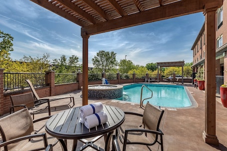 Outdoor pool, pool loungers. Best Western Plus DFW Airport Suites
