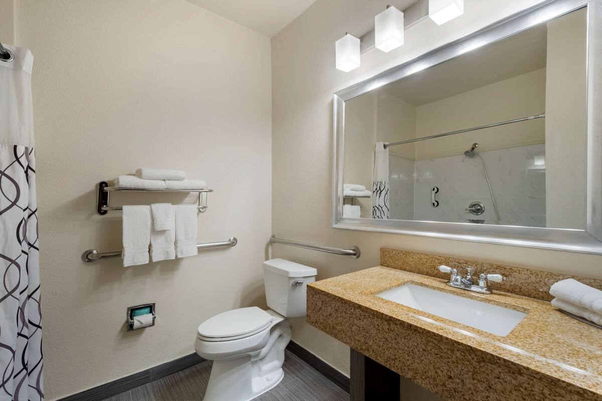 suite, 1 king bed, accessible, refrigerator & microwave | bathroom | combined shower/bathtub, free toiletries, hair dryer, towels