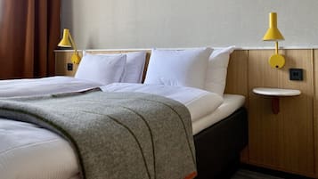 Hypo-allergenic bedding, desk, blackout drapes, soundproofing