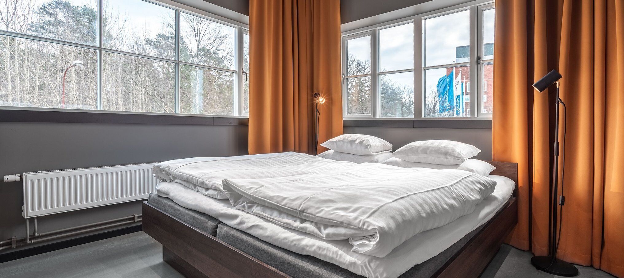 hypo-allergenic bedding, desk, blackout curtains, soundproofing