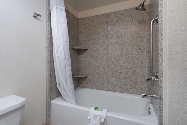 A bathroom with a bathtub, a shower, and a toilet. - Holiday Inn Express Rocklin - Galleria Area by IHG (Rocklin)