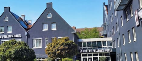 A building with the sign 'Coffee Fellows Hotel' indicating a hotel establishment.