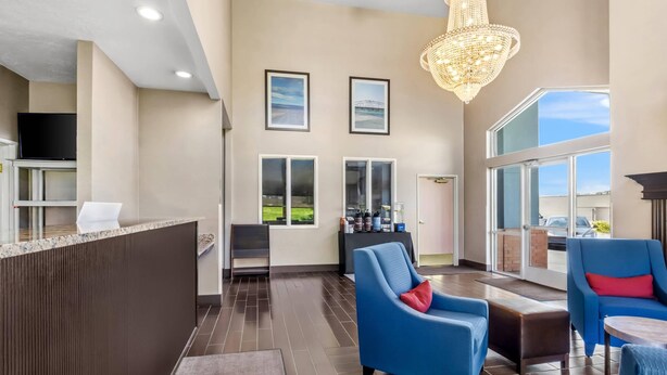 A spacious lobby with a reception desk, seating area, large windows, and a chandelier. - Comfort Inn Elko (Elko)
