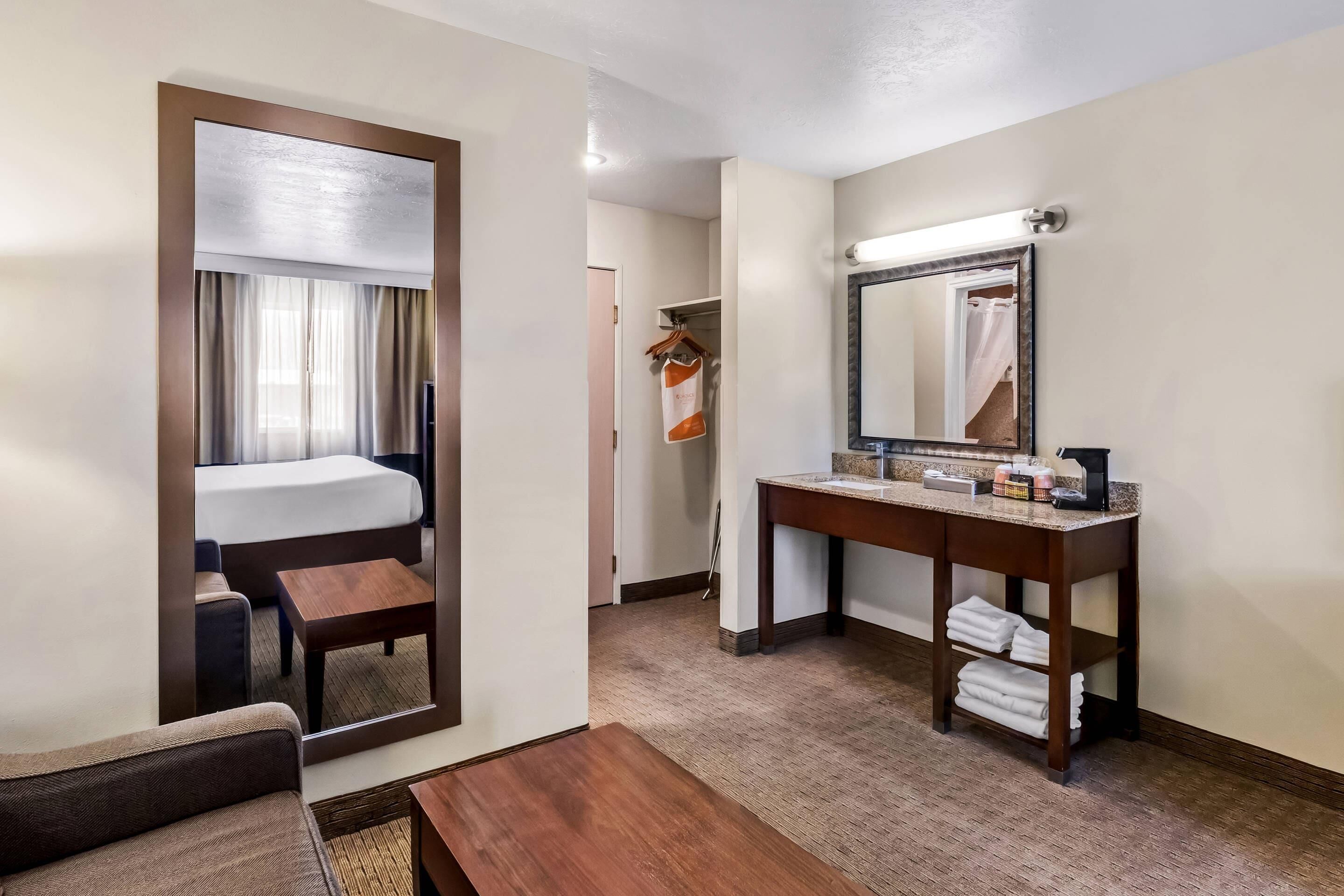 Premium bedding, desk, laptop workspace, iron/ironing board