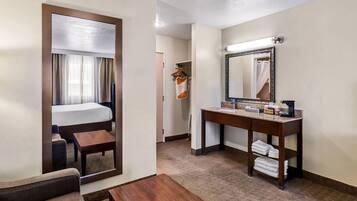 Premium bedding, desk, laptop workspace, iron/ironing board