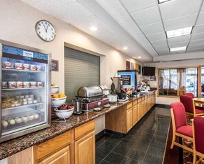 Enjoy a hearty breakfast at our hotel's breakfast area, where a self-service counter offers a variety of food and beverages.