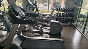 A gym with treadmills, a stationary bike, and a rack of dumbbells. - Holiday Inn Express Pittsburgh-Bridgeville by IHG (Bridgeville)