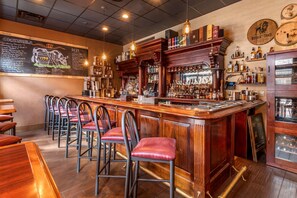 Enjoy a drink at the bar with a selection of beverages on display.