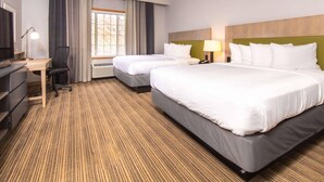 A hotel room with two beds, a desk, a chair, a TV, and a window with curtains. - Country Inn & Suites by Radisson, Rapid City, SD (Rapid City)