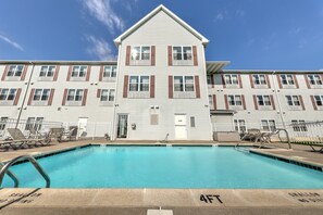 Seasonal outdoor pool, open 9:00 AM to 9:00 PM, pool umbrellas
