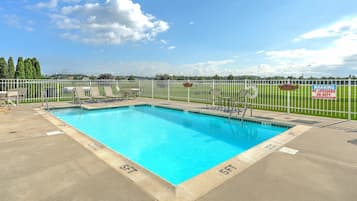 Seasonal outdoor pool, open 9:00 AM to 9:00 PM, pool umbrellas