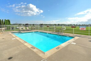 Seasonal outdoor pool, open 9:00 AM to 9:00 PM, pool umbrellas