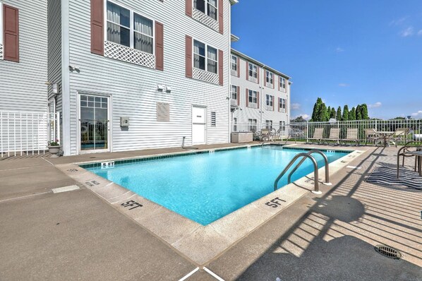 Seasonal outdoor pool, open 9:00 AM to 9:00 PM, pool umbrellas