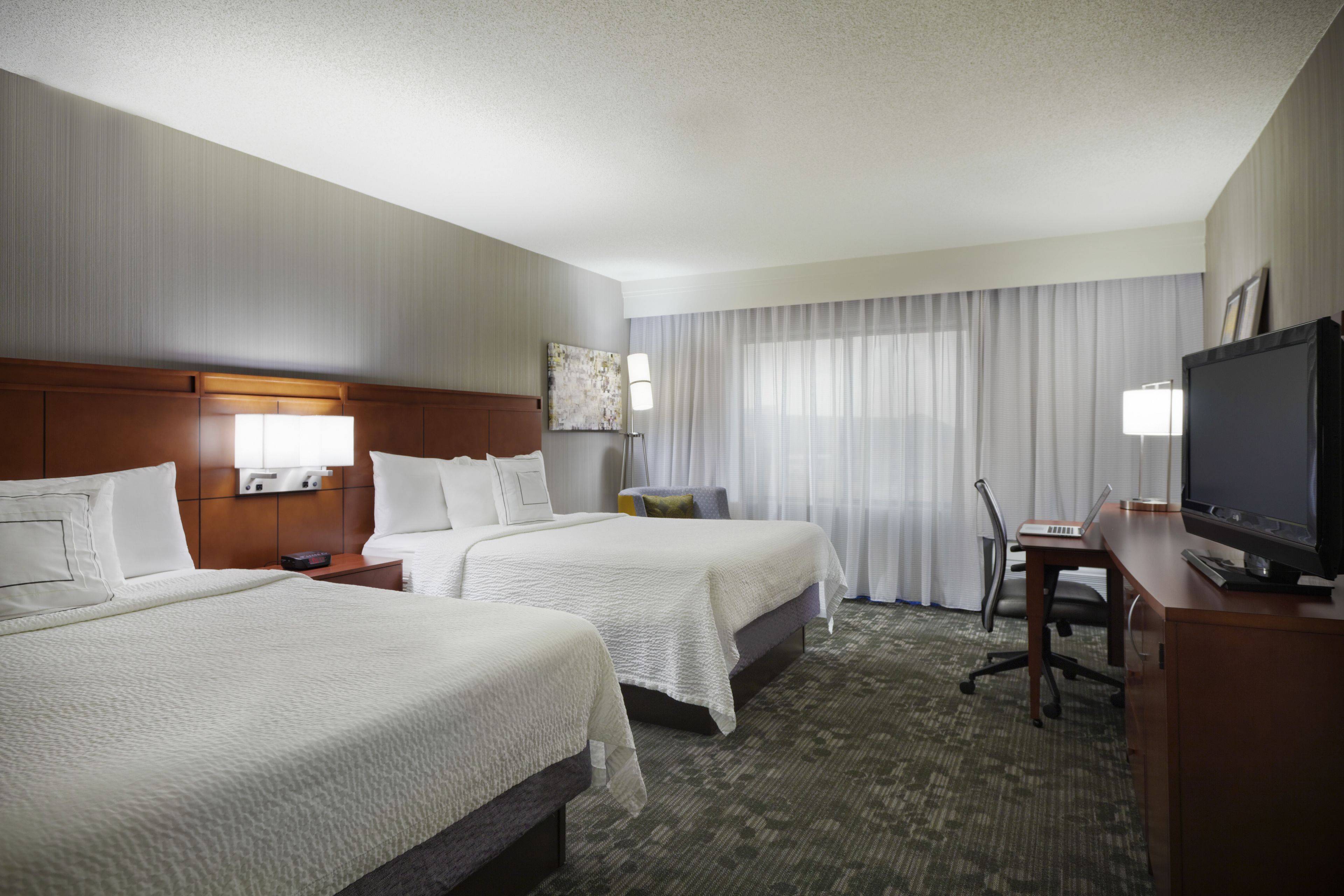 room, 2 queen beds, courtyard view | blackout curtains, iron/ironing board, free cots/infant beds, free wifi