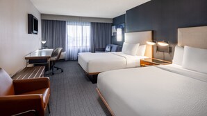 A hotel room with two beds, a desk, a chair, and a TV. - Courtyard by Marriott Salt Lake City Airport (Salt Lake City)