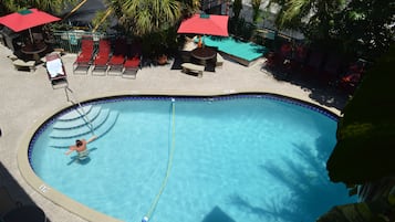 Outdoor pool, open 8:00 AM to 9:00 PM, pool loungers