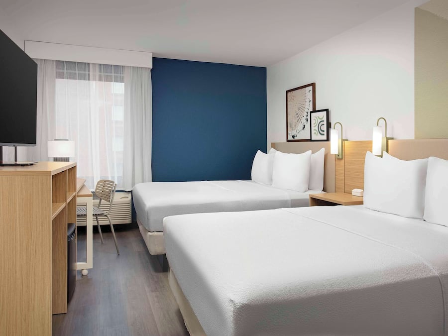 Room, 2 Queen Beds | Premium bedding, desk, iron/ironing board, free cribs/infant beds