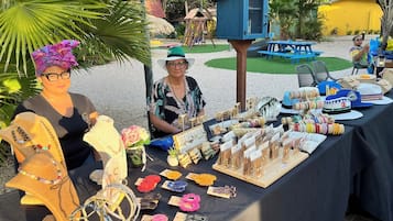 Handmade jewelry and accessories on display at this vibrant market stall.