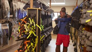A store with rows of scuba diving gear and equipment.