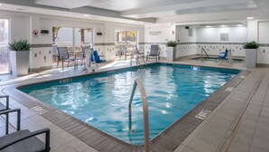 An indoor swimming pool with clear water, surrounded by lounge chairs and a sun deck. - Fairfield Inn & Suites By Marriott Memphis Germantown (Germantown)
