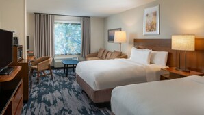 A hotel room with two beds, a desk, a chair, a TV, and a window with curtains. - Fairfield Inn & Suites By Marriott Memphis Germantown (Germantown)