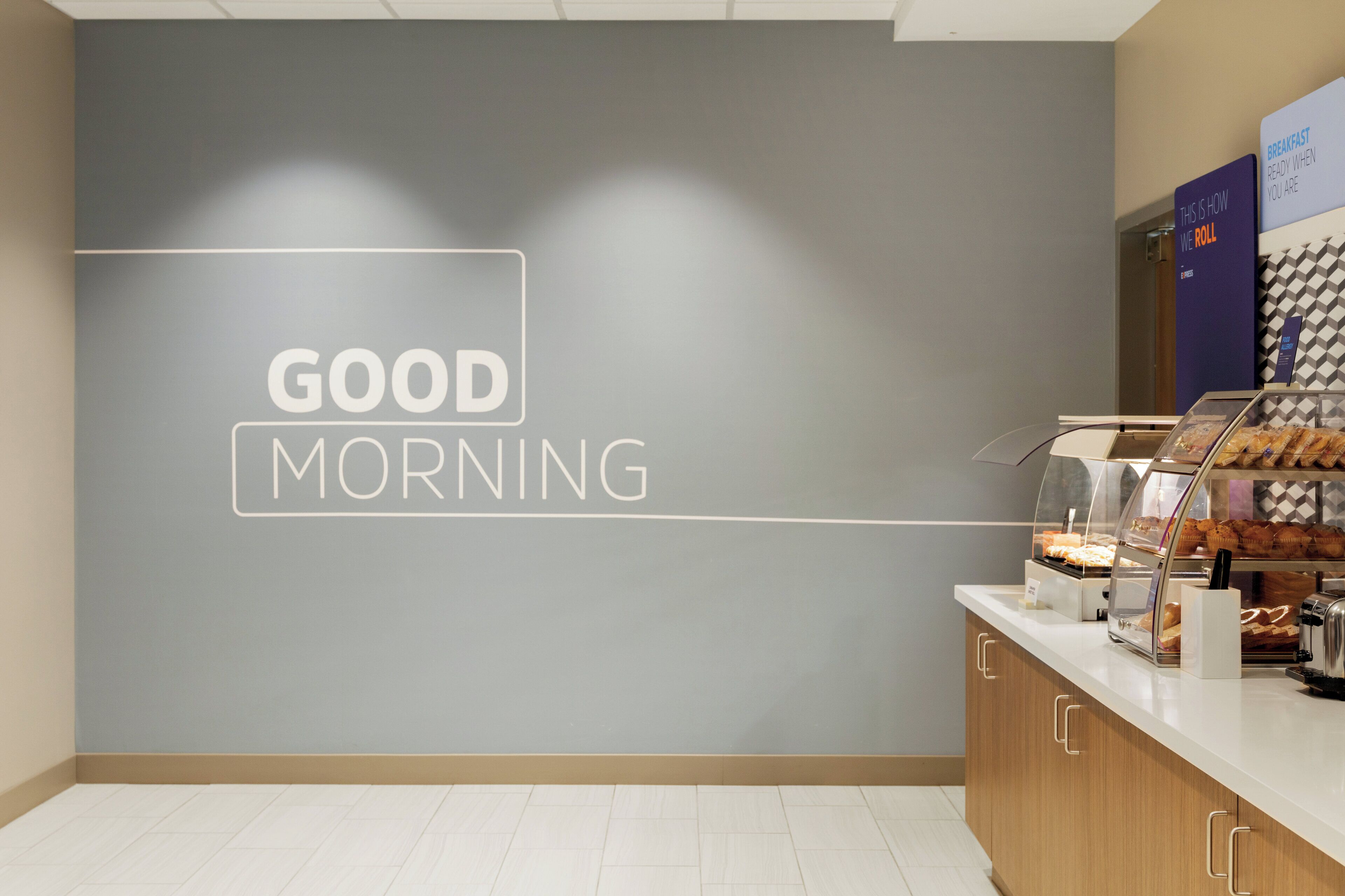 A breakfast counter with a 'GOOD MORNING' sign on the wall.