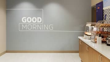 A breakfast counter with a 'GOOD MORNING' sign on the wall.