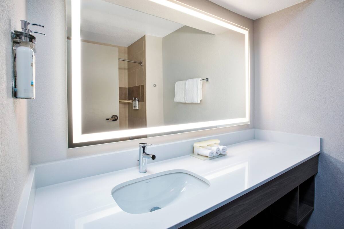 standard room, 2 queen beds | bathroom | hair dryer, towels