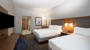 A hotel room with two beds, a desk, a chair, a TV, and a framed picture on the wall. - Holiday Inn Express Hotel & Suites Columbus by IHG (Columbus)