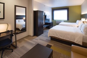 A hotel room with two beds, a desk, a chair, a wardrobe, and a large mirror. - Holiday Inn Express & Suites Worthington by IHG (Worthington)