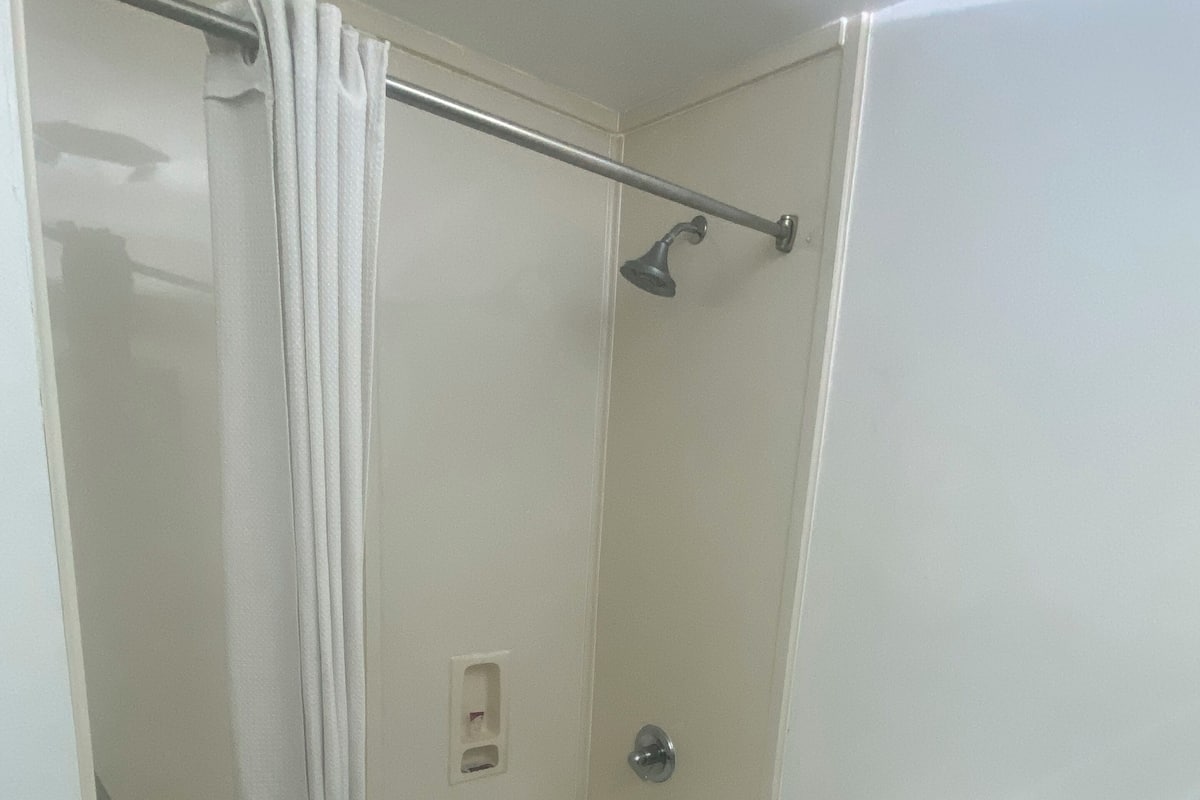 Combined shower/tub, hair dryer, towels, soap
