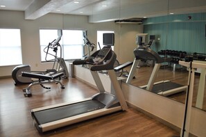A gym with treadmills, elliptical machines, and free weights. - Holiday Inn Express & Suites Batesville by IHG (Batesville)