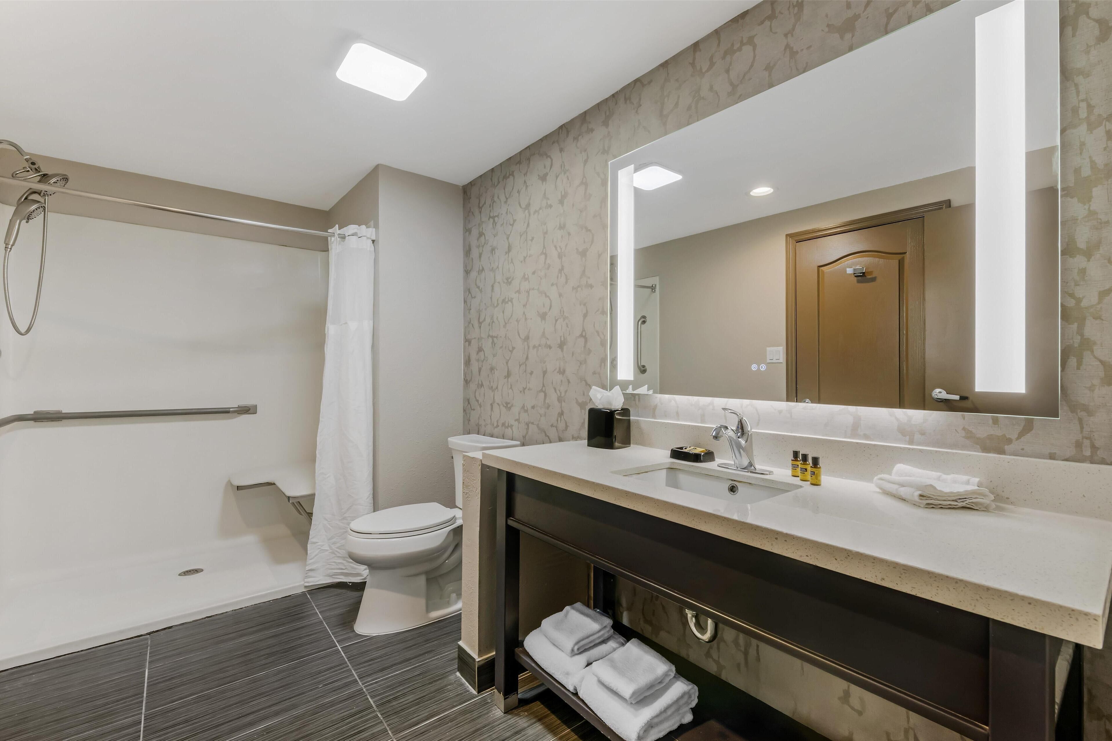 executive suite, 1 king bed, non smoking, refrigerator & microwave | bathroom | free toiletries, hair dryer, towels