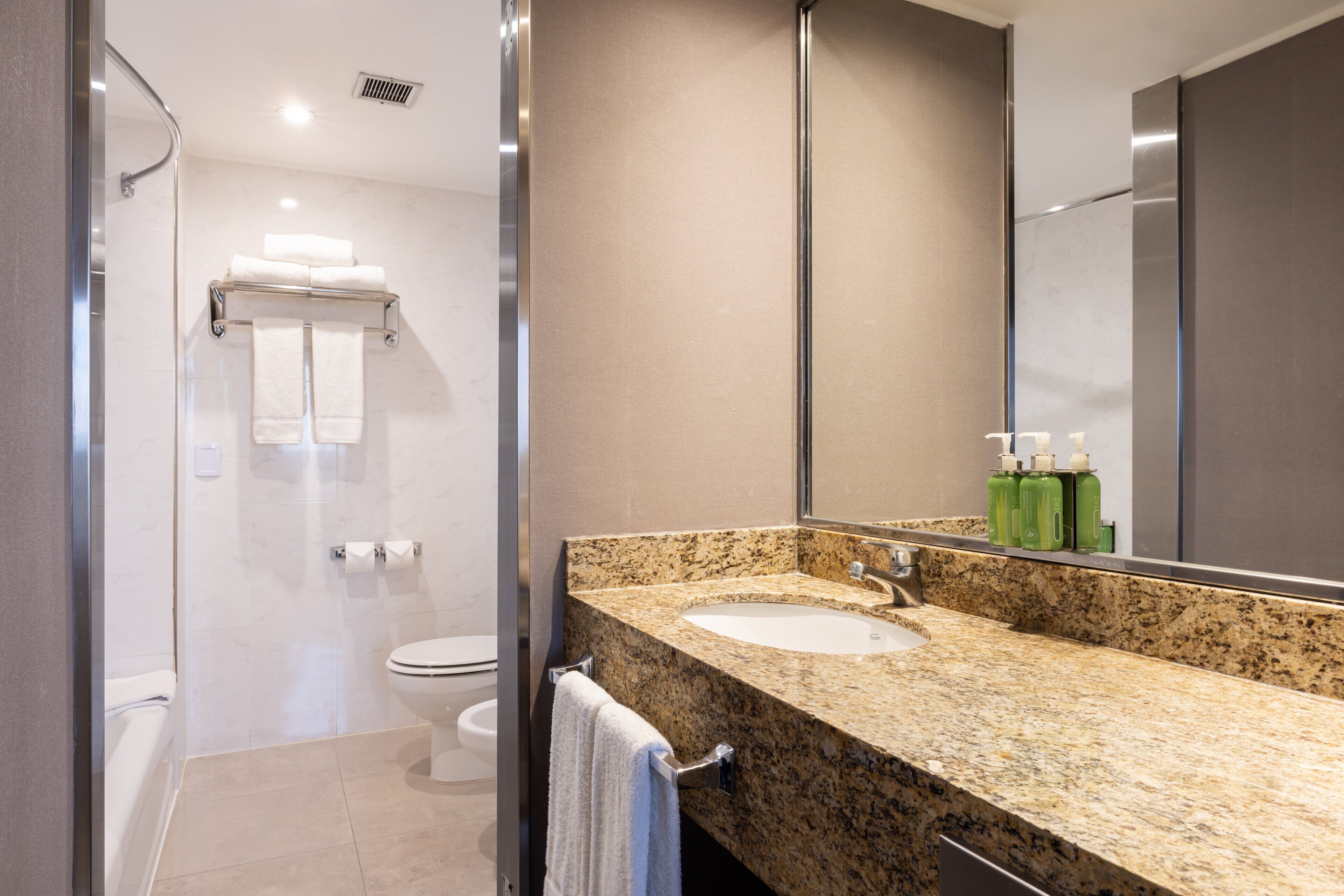 suite, 1 king bed, city view | bathroom | combined shower/bathtub, deep-soaking bathtub, eco-friendly toiletries