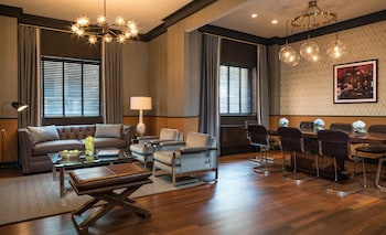 Flat-screen TV, books at Gild Hall, A Thompson Hotel, by Hyatt