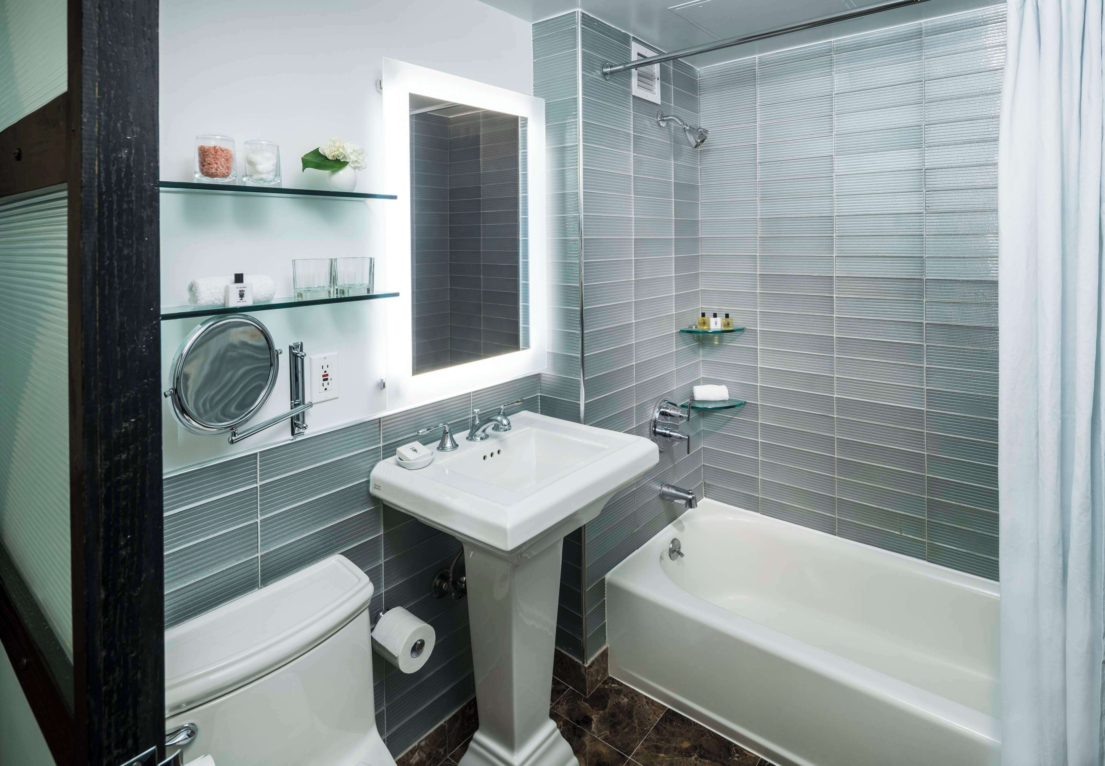 combined shower/bathtub, designer toiletries, hair dryer, bathrobes