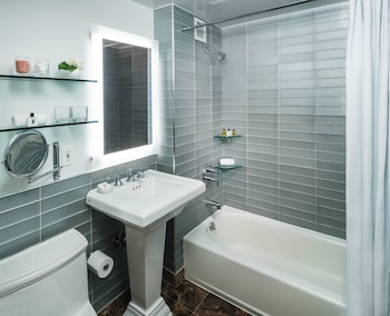 Combined shower/tub, designer toiletries, hair dryer, bathrobes at Gild Hall, A Thompson Hotel, by Hyatt