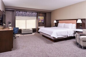 Premium bedding, desk, laptop workspace, blackout curtains