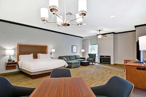 Premium bedding, laptop workspace, iron/ironing board