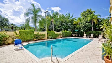 Outdoor pool, open 6:00 AM to 7:00 PM, pool umbrellas